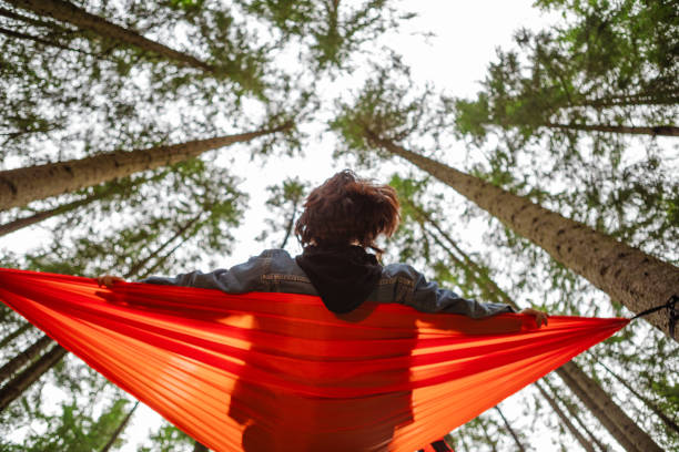 istock happy woman on hammock in the forest 1645910521