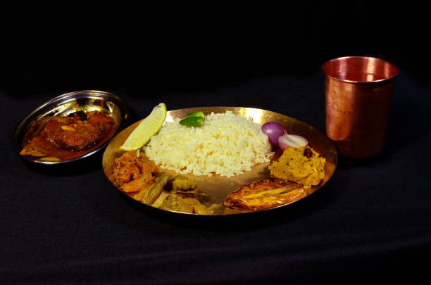 istock Spicy and tasty Rohu Fish curry dish & indian rice 1645911079