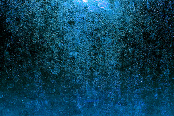 istock Black dark blue red brown shiny glitter abstract background with space. Twinkling glow stars effect. Like outer space, night sky, universe. Rusty, rough surface, grain. 1645929421