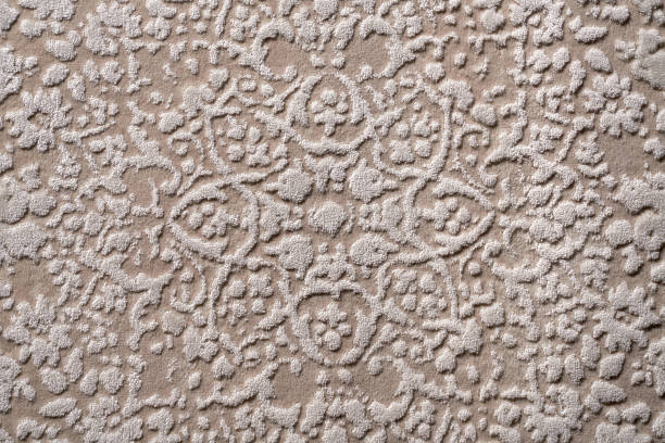 istock Texture of ornate, decorative velours carpet fabric pattern. 1645945500