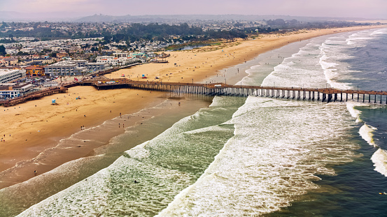 Aerial view of Pismo beach pier and Pismo beach along coastline, California, USA.