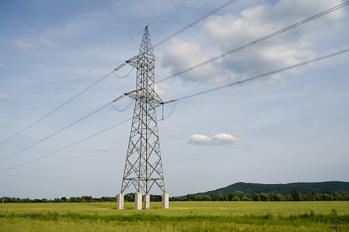 Energo. Power distribution station. high-voltage electric transmission of a pylon silhouette tower.