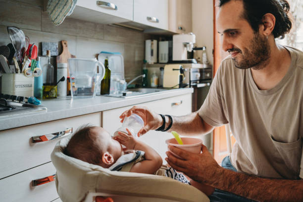 istock A father is feeding his son in the kitchen at home 1645967192