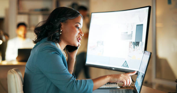 istock Phone call, planning and night with business woman at computer for strategy, networking and digital marketing. Leadership, management and deal with employee in office for help, review and website 1645986246