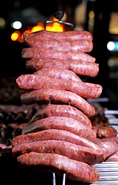 istock Grilled Creole sausages on a barbecue. Selective focus. 1646018394