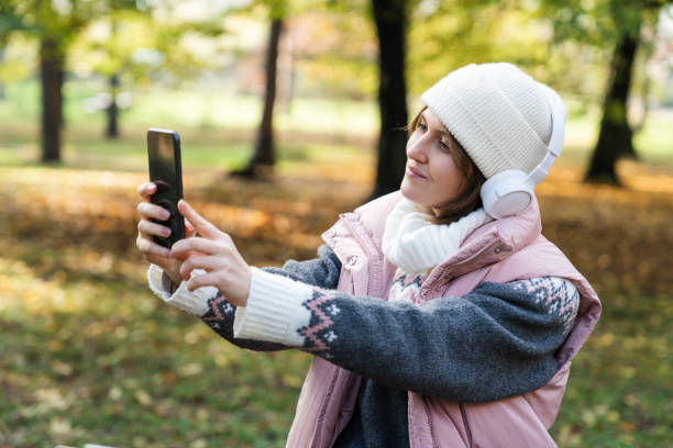 istock Woman taking selfie on smartphone 1646054785