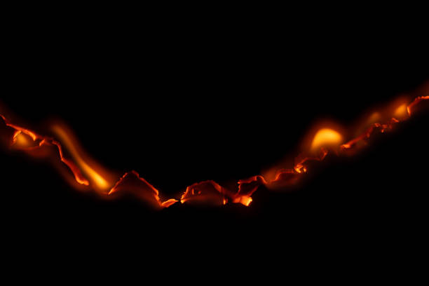 burning paper, glowing edge of paper on a black background