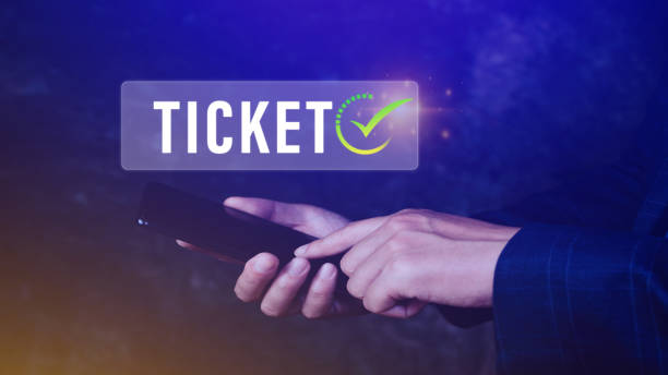 istock Businessman holding smartphone with button Ticket word, Business, Technology, internet and networking concept businessman pressing online booking button on virtual screens. 1646087528