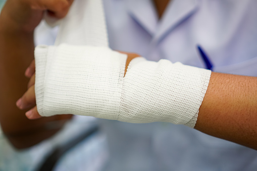 Bandaging Injury Image Showing Demonstration Of Using A White Elastic Mesh Gauze Bandage ...