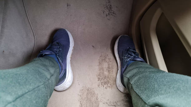 istock Sneakers Leave a Mark on Car's Carpet 1646098887
