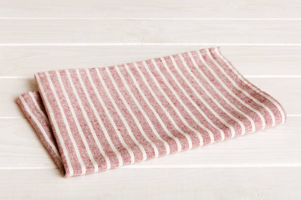 istock top view with red empty kitchen napkin isolated on table background. Folded cloth for mockup with copy space, Flat lay. Minimal style 1646118570