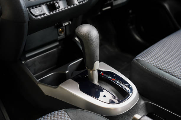 istock automatic transmission shift selector in the car interior. Closeup a manual shift of modern car gear shifter. 4x4 gear shift 1646130557