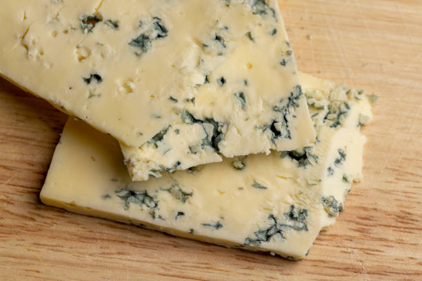 istock Cheese with blue mold cut into pieces 1646182878