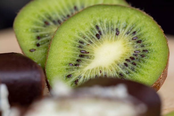 Green fresh kiwi during cooking, fresh green kiwi while cooking food in the kitchen