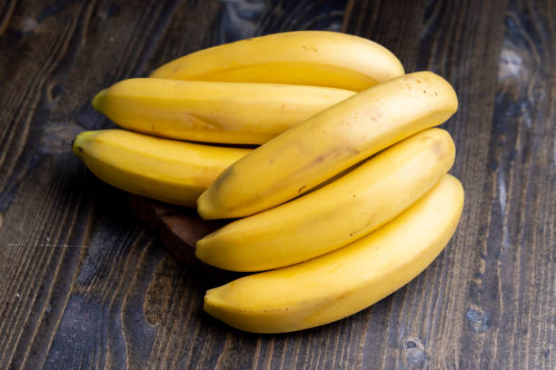 istock Ripe yellow bananas on the table 1646186189