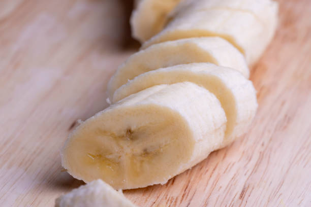 istock Sliced ripe banana on a cutting board 1646186196
