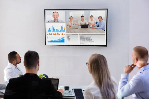 istock Businesspeople Video Conferencing In Boardroom 1646204951