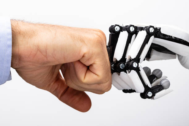 istock Human Hand And Robot Making Fist Bump 1646204970