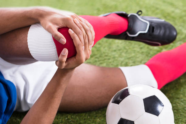 istock Injured Soccer Player On Field 1646206071