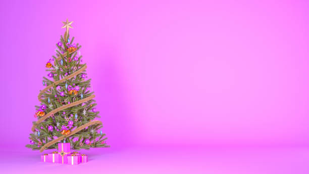 istock Christmas tree decorated with presents on pink background with copy space 1646211424