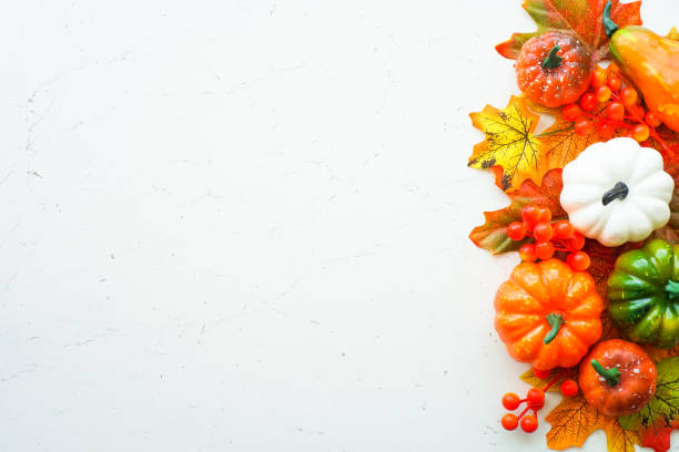 istock Fall autumn flat lay background. Pumpkins and fall leaves. 1646250504
