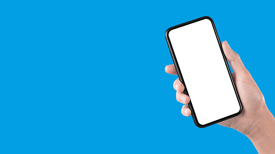 The female hand holds a smartphone with a white screen. Horizontal template banner design with blue colored background.