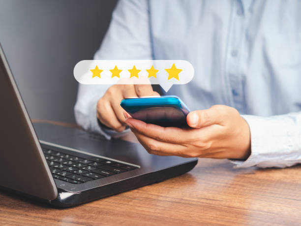 istock A customer using a smartphone gives the five-star icon a rating of very impressed for service while sitting in the office 1646254721