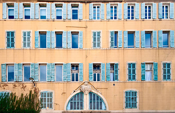 French windows Texture of typical sothern french windows at the street "Cours Jean Ballard" in Marseille, France marseille panier stock pictures, royalty-free photos & images