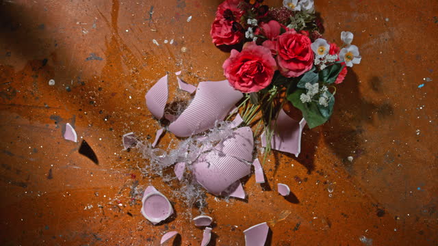 SLO MO LD Vase with flowers breaking when hitting the ground