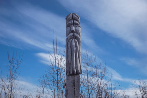 istock Wooden totem with a sky background 1646313714