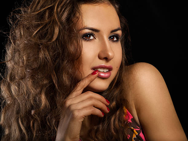 istock sweet young woman on black background 164631489