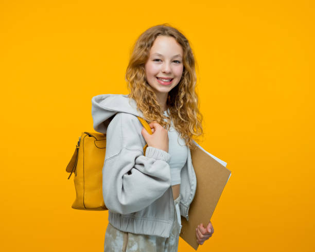 istock Portrait of friendly high school student 1646319797