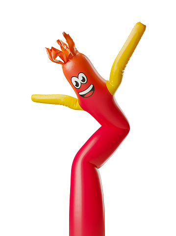 Bright red inflatable tube character dancing in the wind isolated on white background