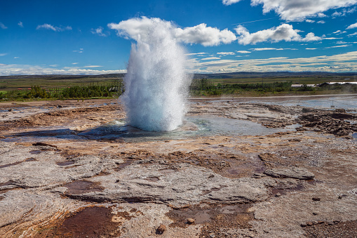 Eruption of Strokkur geyser - famous natural touristic attraction of Iceland in Geysir area