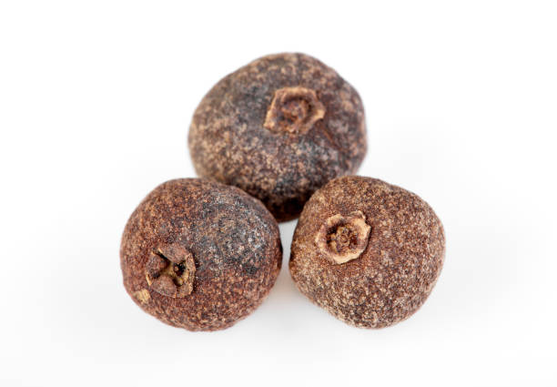 istock whole allspice isolated on white background. Aromatic allspice. 1646336812