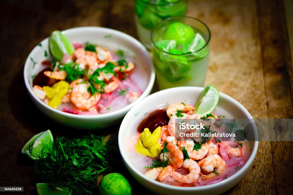 Two bowls of shrimp ceviche with wedges of lime Ecuadorian Ceviche of Shrimp Seviche Stock Photo