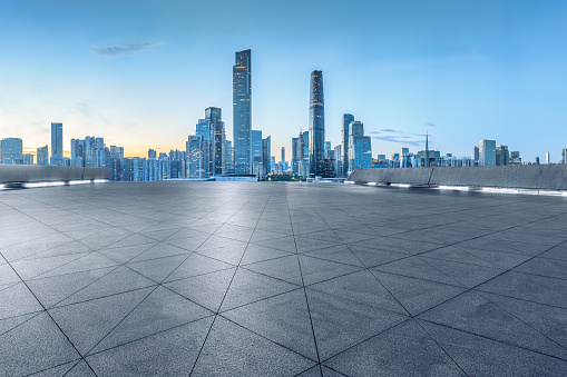 Clean square pavement and cityscape in Guangzhou, China