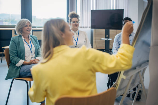 istock People in the modern office having a meeting and presentation 1646360636
