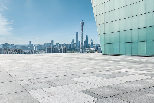 Clean square pavement and cityscape in Guangzhou, China