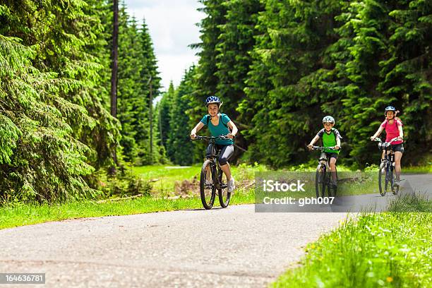 Active Family Biking Stock Photo - Download Image Now - 14-15 Years, 16-17 Years, 40-44 Years