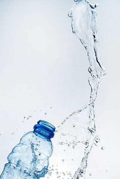 istock Water splash out of glass 164637099