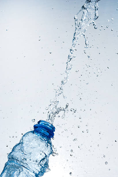 istock Water splash out of glass 164637106
