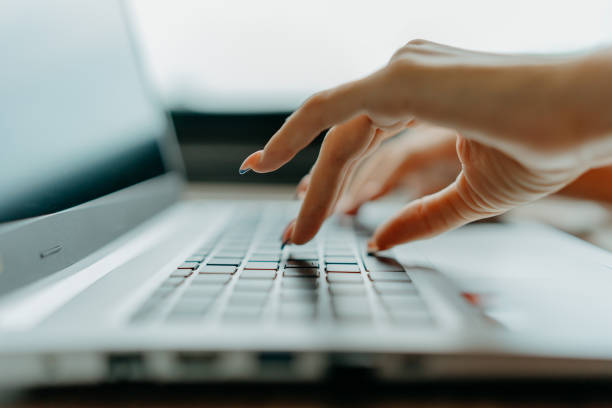 istock Close up female hand typing on laptop 1646378167
