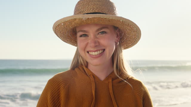 Beach, summer and face of woman with smile on holiday, vacation and freedom by sea on weekend. Happy, travel and portrait of female person with hat for tropical Bali, relaxing and adventure in nature