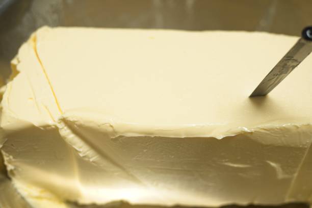 istock Butter block in the bit bowl, with a knife on top. 1646391186
