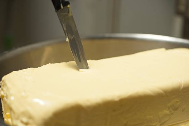 istock Butter block in the bit bowl, with a knife on top. 1646391191