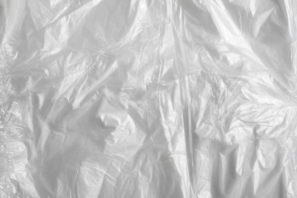 istock white plastic bag on white background. A White Plastic Bag Texture, macro, background. Reduction of plastic bags for natural treatment. The symbol of the campaign to refrain from using plastic bags. 1646393765
