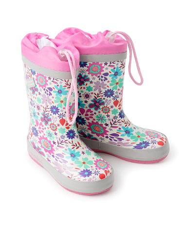 Children's waterproof white rubber boots with a bright floral pattern. A new pair of shoes on a white background.