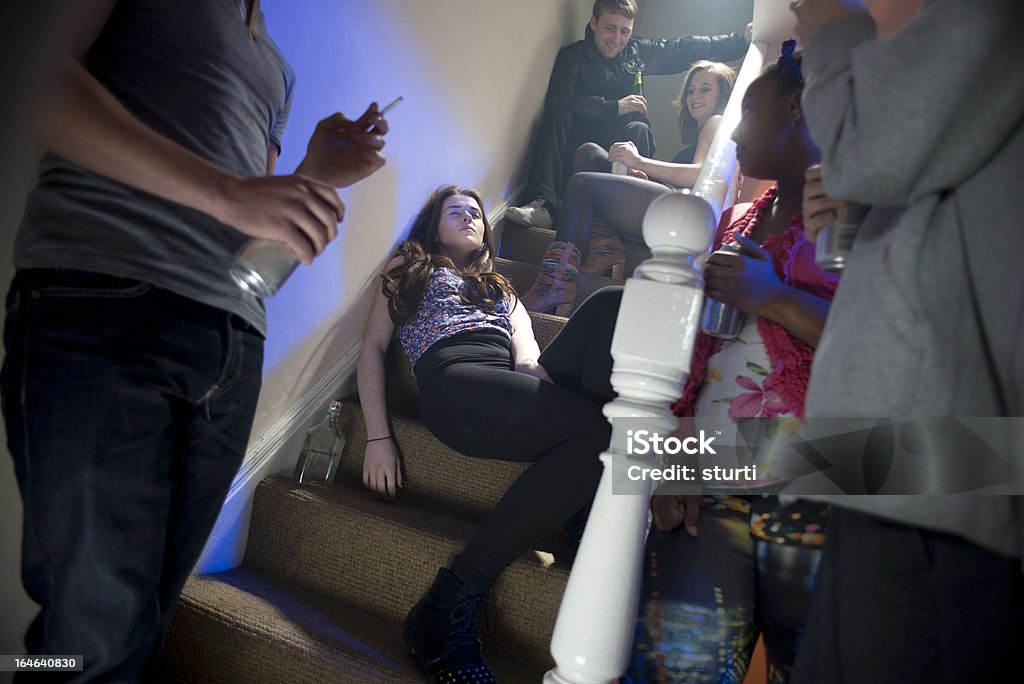 teenage booze at a house party teenage girl passed out  at a house party Teenager Stock Photo