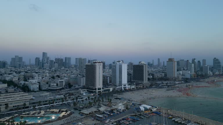 Aerial 50p footage of the waterfront of Tel Aviv - Yafo  at afternoon and dusk in summer